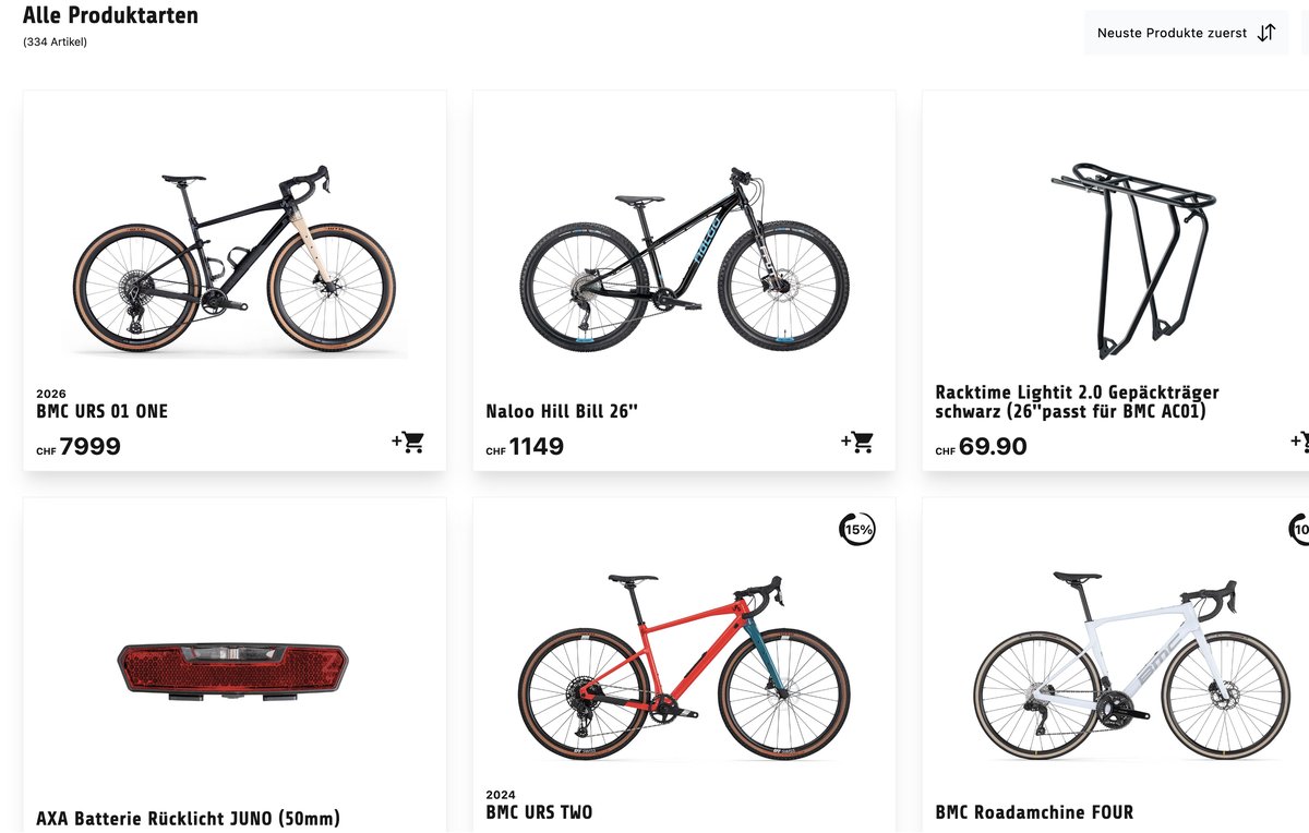 Produktübersicht auf bikestore.ch: Webshop-Raster mit BMC URS 01 ONE, Naloo Hill Bill 26 Zoll, Racktime-Gepäckträger und weiteren Bikes plus Zubehör, sortiert nach Neueste-Produkte-zuerst.